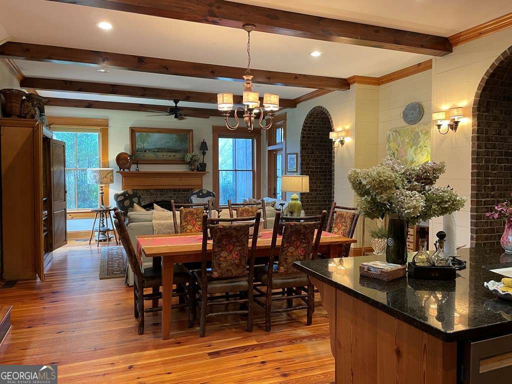 2106 Adams Street Vidalia, GA 30474 - Photo 4 of 47 a dining table with chairs and wooden floor