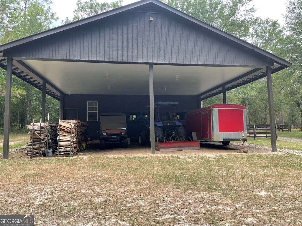 2106 Adams Street Vidalia, GA 30474 - Photo 46 of 47 a blue bench sitting in front of a building