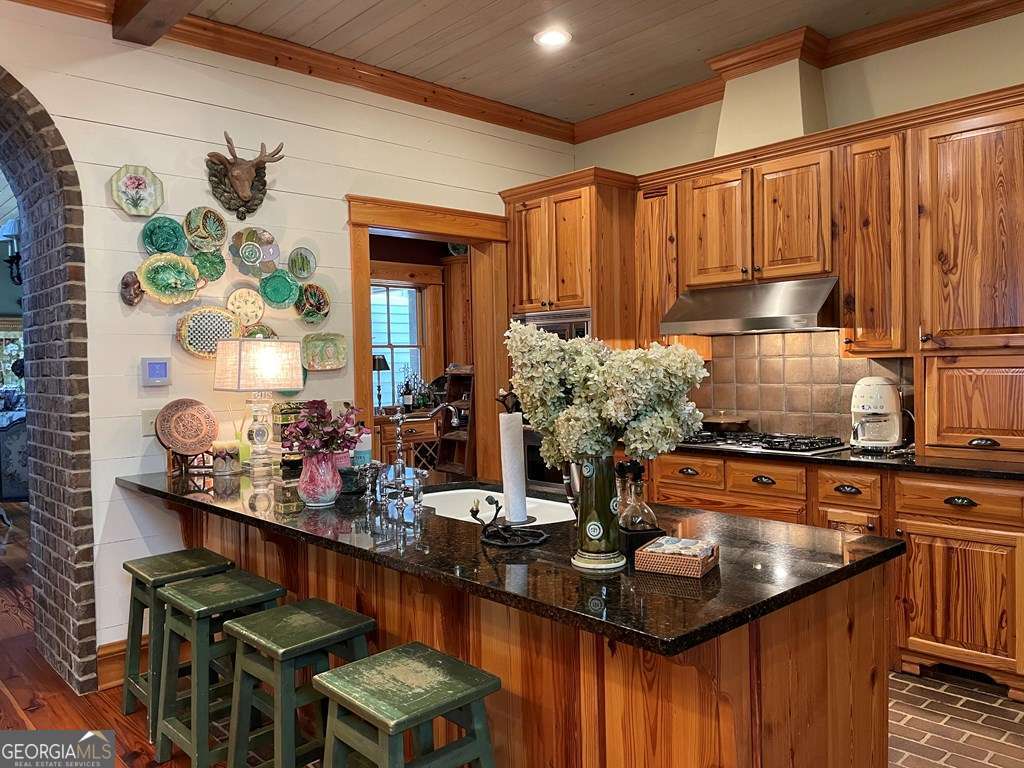 2106 Adams Street Vidalia, GA 30474 - Photo 5 of 47 a kitchen with stainless steel appliances a stove a sink and a refrigerator