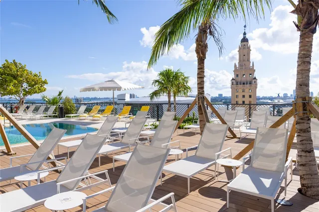 a view of yard with swimming pool and outdoor seating
