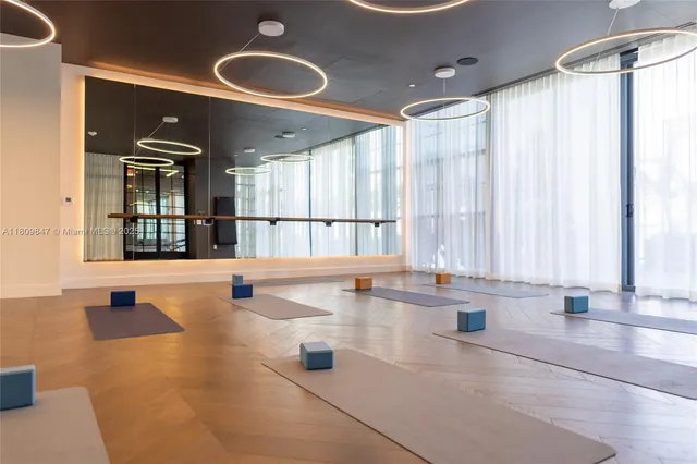 a large white kitchen with a large window