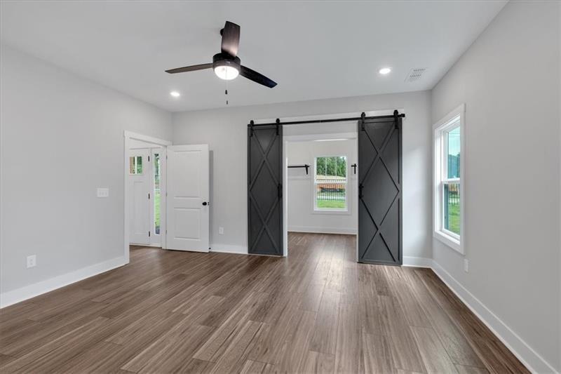 133 Old Alabama Road Southeast Emerson, GA 30137 - Photo 21 of 44 a view of an empty room with wooden floor and a window