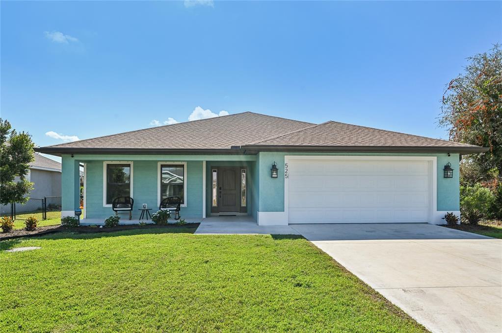 525 Sunset Road North Rotonda West, FL 33947 - Photo 1 of 1 a front view of a house with a yard and porch