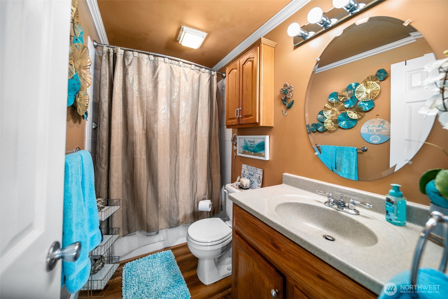 8903 Crescent Bar Road Northwest, Unit 101 Quincy, WA 98848 - Photo 19 of 40 a bathroom with a sink a toilet and shower curtain