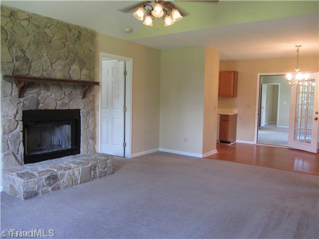 140 Farmview Road Madison, NC 27025 - Photo 9 of 16 Living Room. With rock fireplace