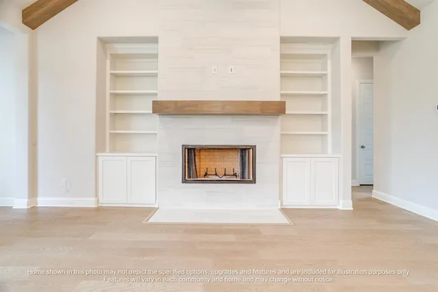 a large white kitchen with a sink a refrigerator and a stove