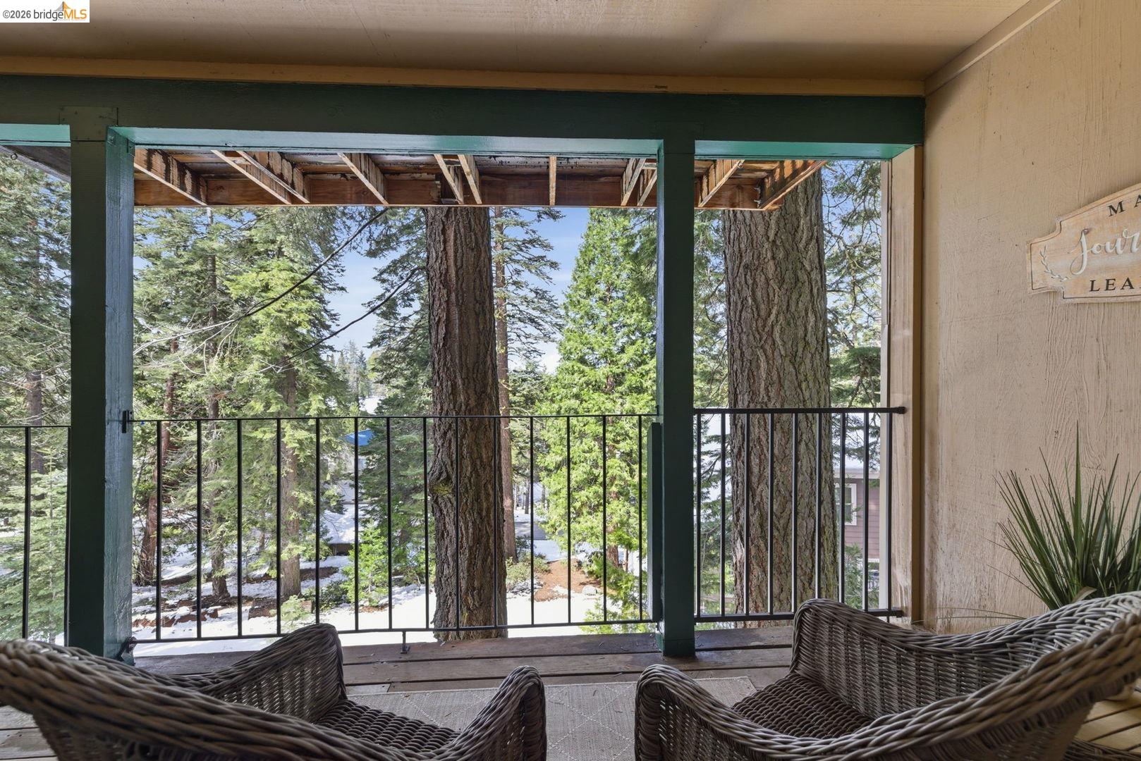 33840 Upper Leland Road, Unit 25A Pinecrest, CA 95364 - Photo 23 of 41 a view of a living room and floor to ceiling window and wooden floor