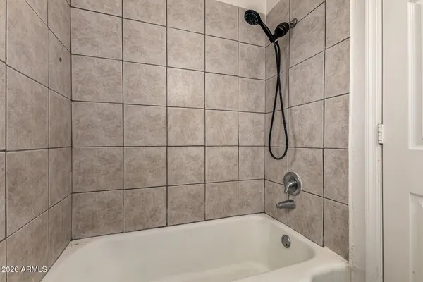 a bathroom with a bath tub