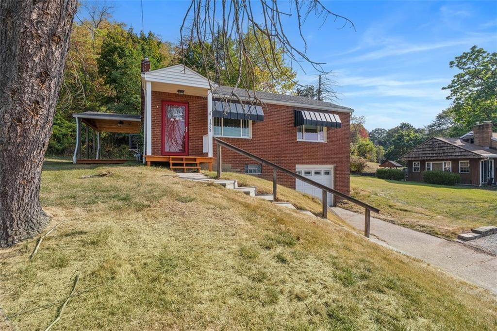 1858 Brodhead Road Aliquippa, PA 15001 - Photo 4 of 27 a view of a house with a yard