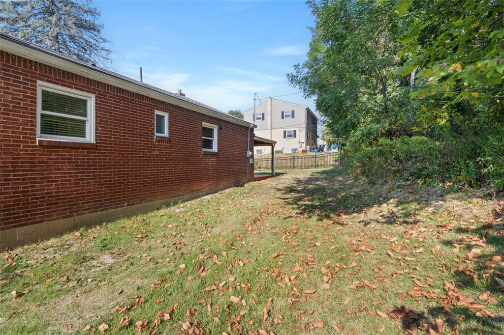 1858 Brodhead Road Aliquippa, PA 15001 - Photo 6 of 27 a pathway of a house with a yard