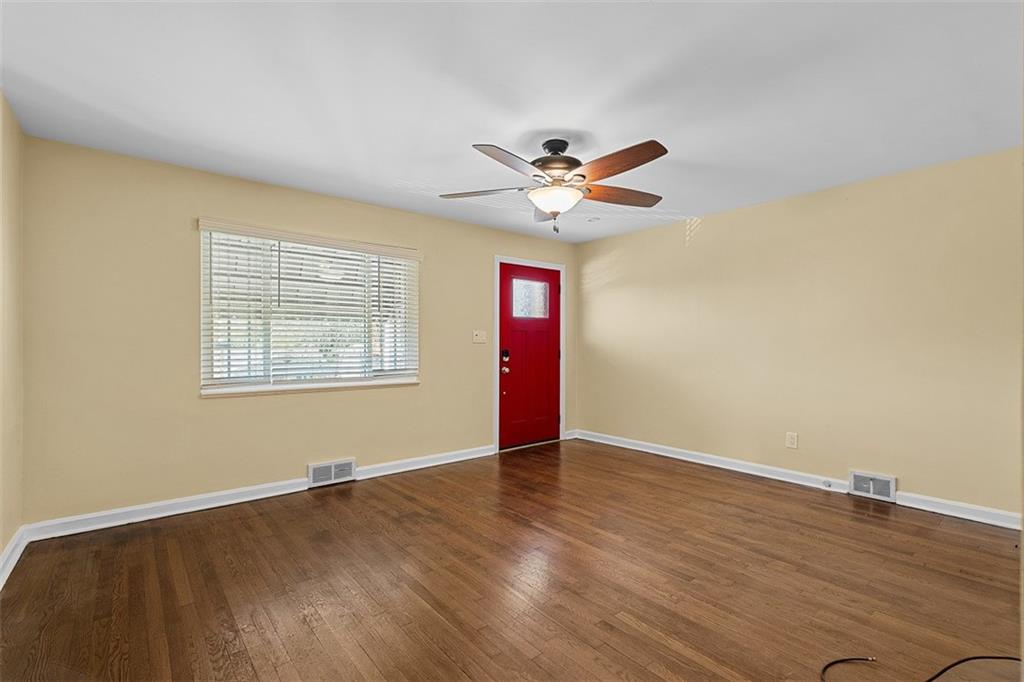 1858 Brodhead Road Aliquippa, PA 15001 - Photo 7 of 27 a view of an empty room with wooden floor and a window