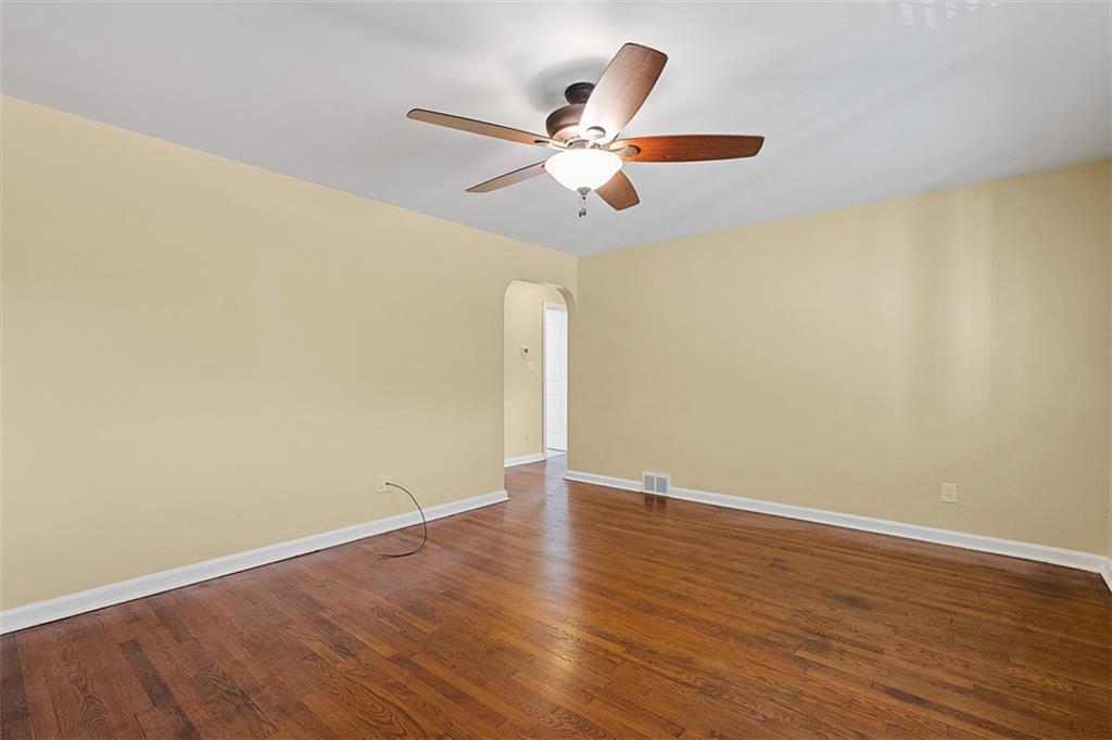 1858 Brodhead Road Aliquippa, PA 15001 - Photo 8 of 27 a view of wooden floor and a chandelier fan