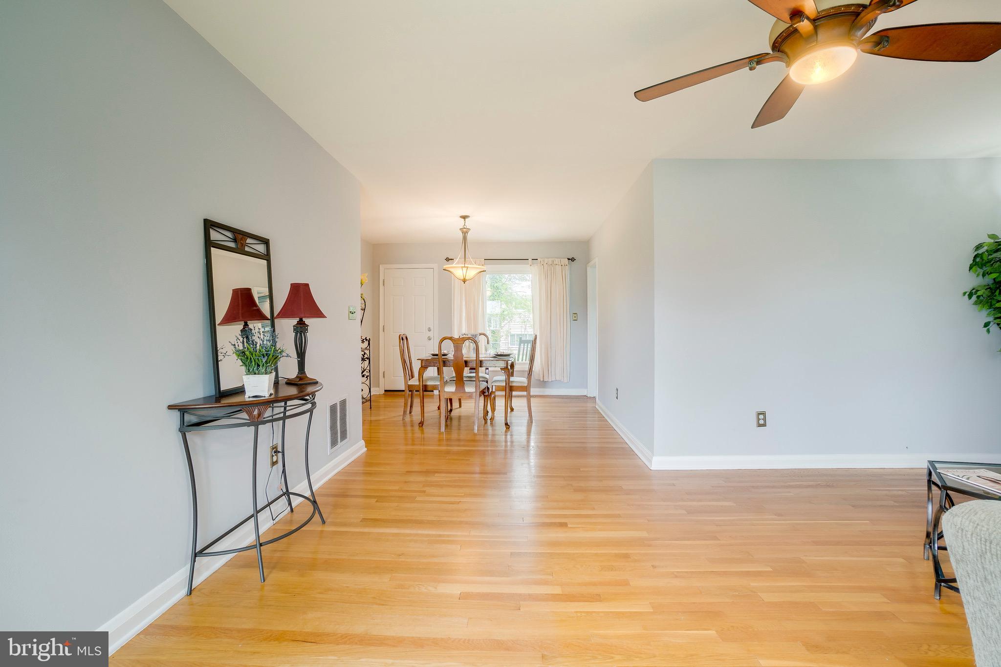 905 Sedgley Road Baltimore, MD 21228 - Photo 8 of 38 LR w/ceiling fan and lovely hardwood floots