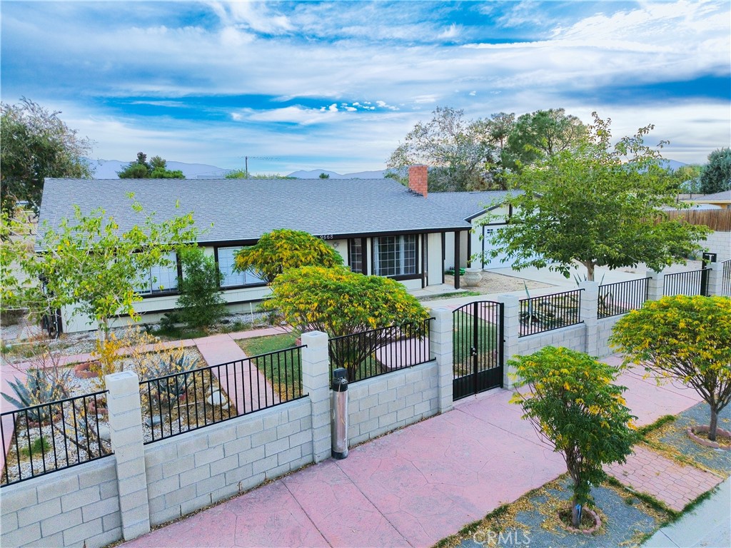 9668 East Ave R 14 Littlerock, CA 93543 - Photo 1 of 34 a view of a house with brick walls