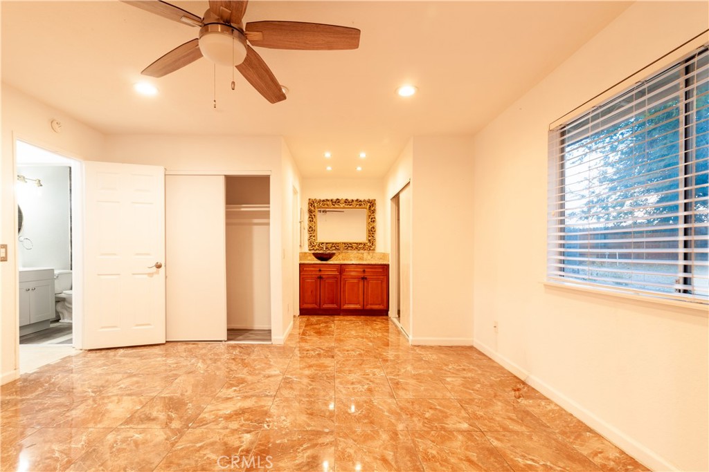 9668 East Ave R 14 Littlerock, CA 93543 - Photo 19 of 34 a view of a room with a kitchen and a window