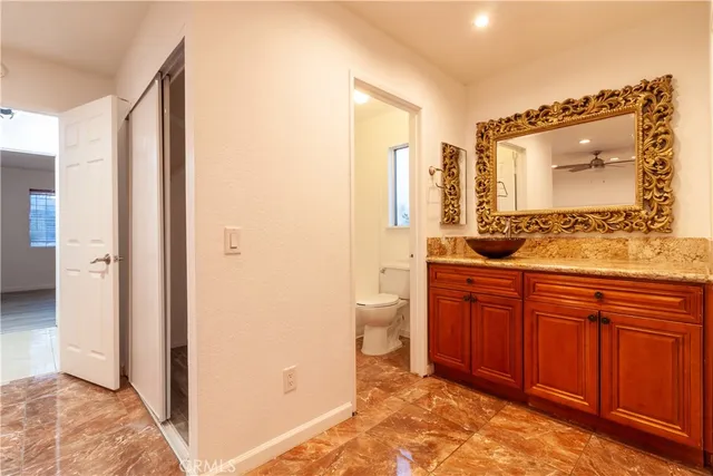 a spacious bathroom with a double vanity sink and a mirror