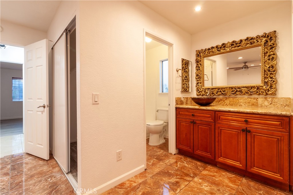 9668 East Ave R 14 Littlerock, CA 93543 - Photo 21 of 34 a spacious bathroom with a double vanity sink and a mirror