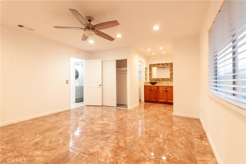 9668 East Ave R 14 Littlerock, CA 93543 - Photo 23 of 34 a view of a livingroom with a kitchen and a stove top oven