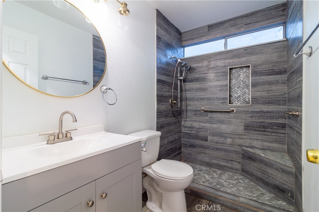 9668 East Ave R 14 Littlerock, CA 93543 - Photo 25 of 34 a bathroom with a sink toilet and shower