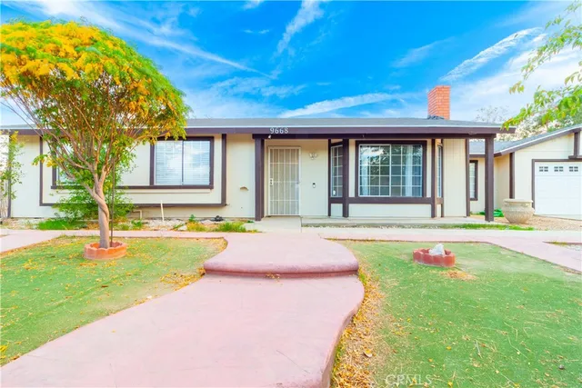 a swimming pool with patio outdoor seating and yard