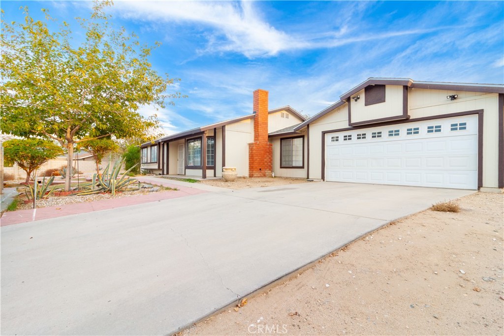 9668 East Ave R 14 Littlerock, CA 93543 - Photo 6 of 34 a front view of a house with a road