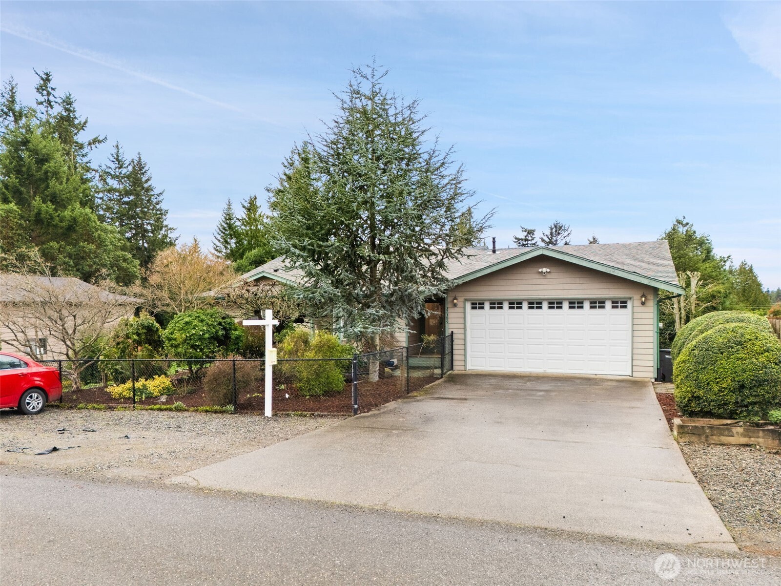 a view of a house with a yard and garage