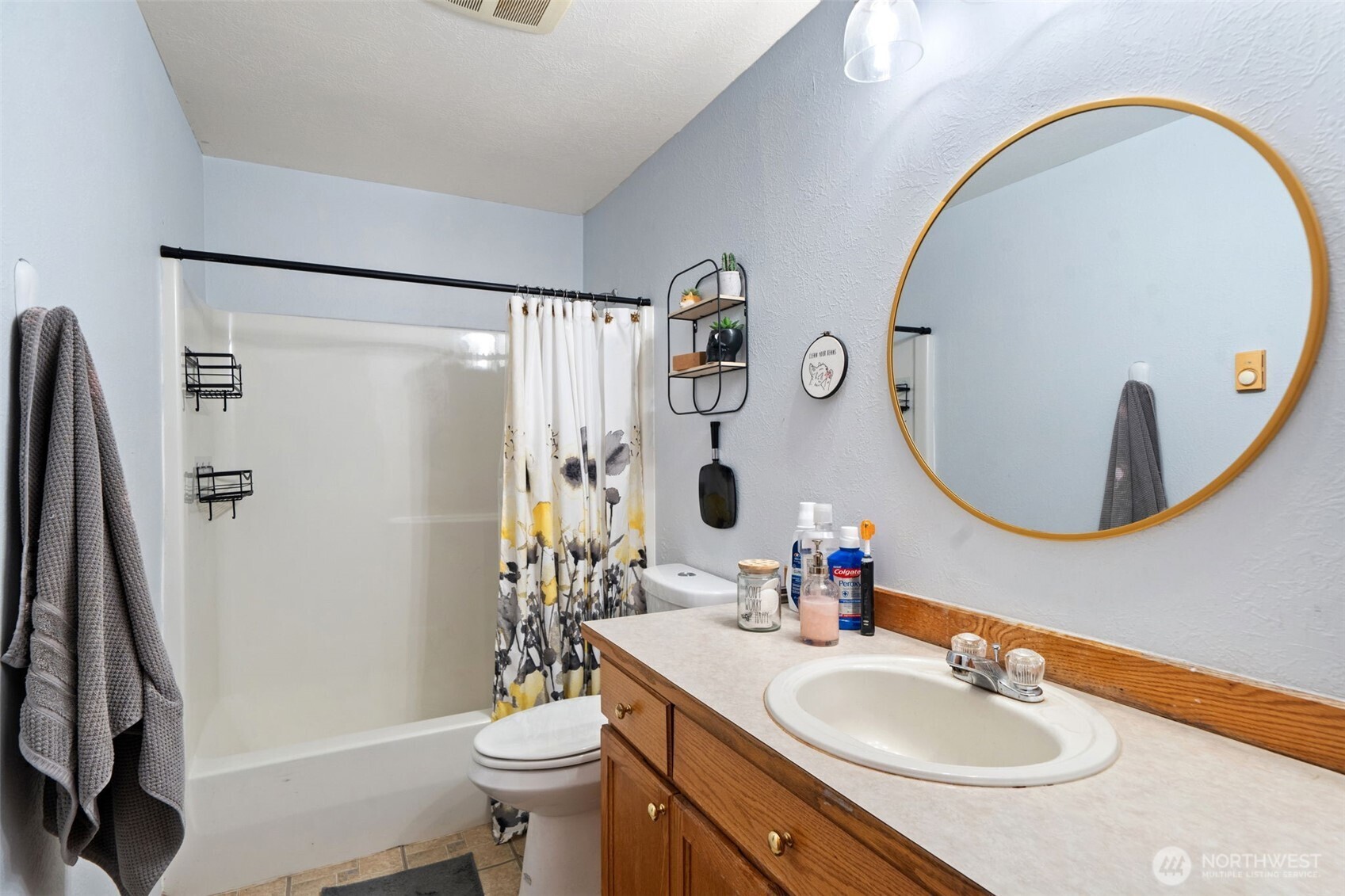 37399 Buck Road Northeast Hansville, WA 98340 - Photo 13 of 40 a bathroom with a sink toilet and a mirror
