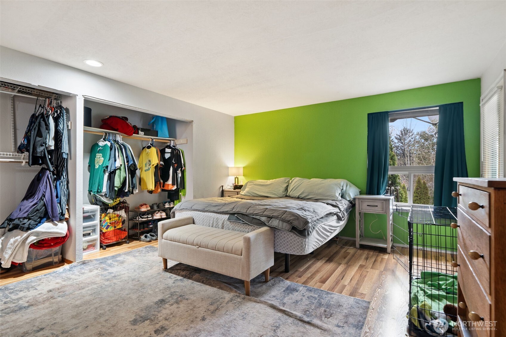 37399 Buck Road Northeast Hansville, WA 98340 - Photo 14 of 40 a bedroom with a bed and a view of living room