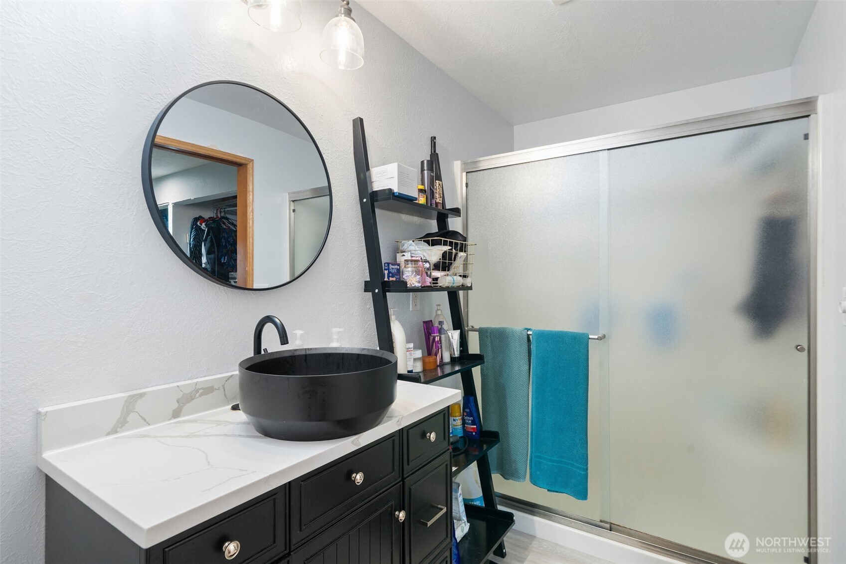 37399 Buck Road Northeast Hansville, WA 98340 - Photo 16 of 40 a bathroom with a sink and a mirror