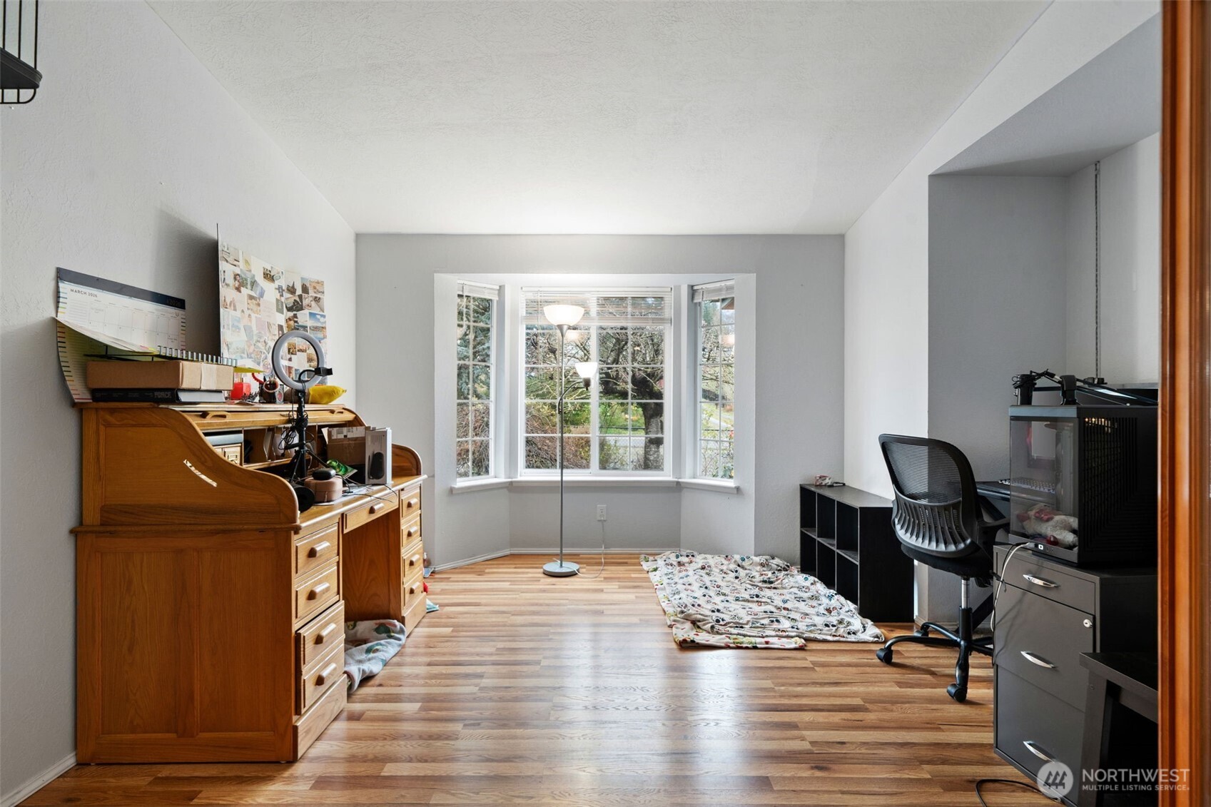 37399 Buck Road Northeast Hansville, WA 98340 - Photo 17 of 40 a view of a workspace with furniture and a window