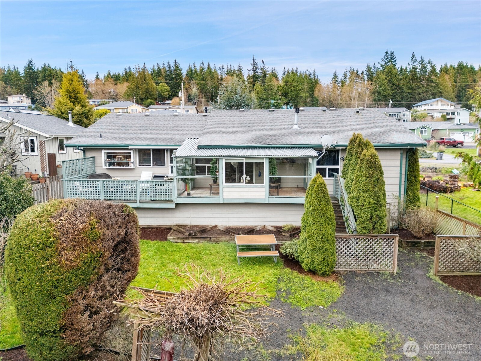 37399 Buck Road Northeast Hansville, WA 98340 - Photo 24 of 40 a aerial view of a house with swimming pool and next to trees