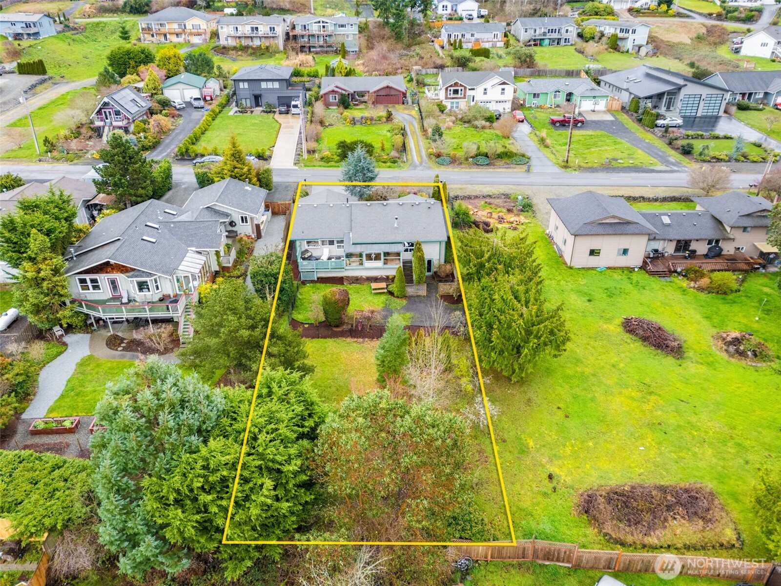 37399 Buck Road Northeast Hansville, WA 98340 - Photo 35 of 40 an aerial view of residential houses with outdoor space