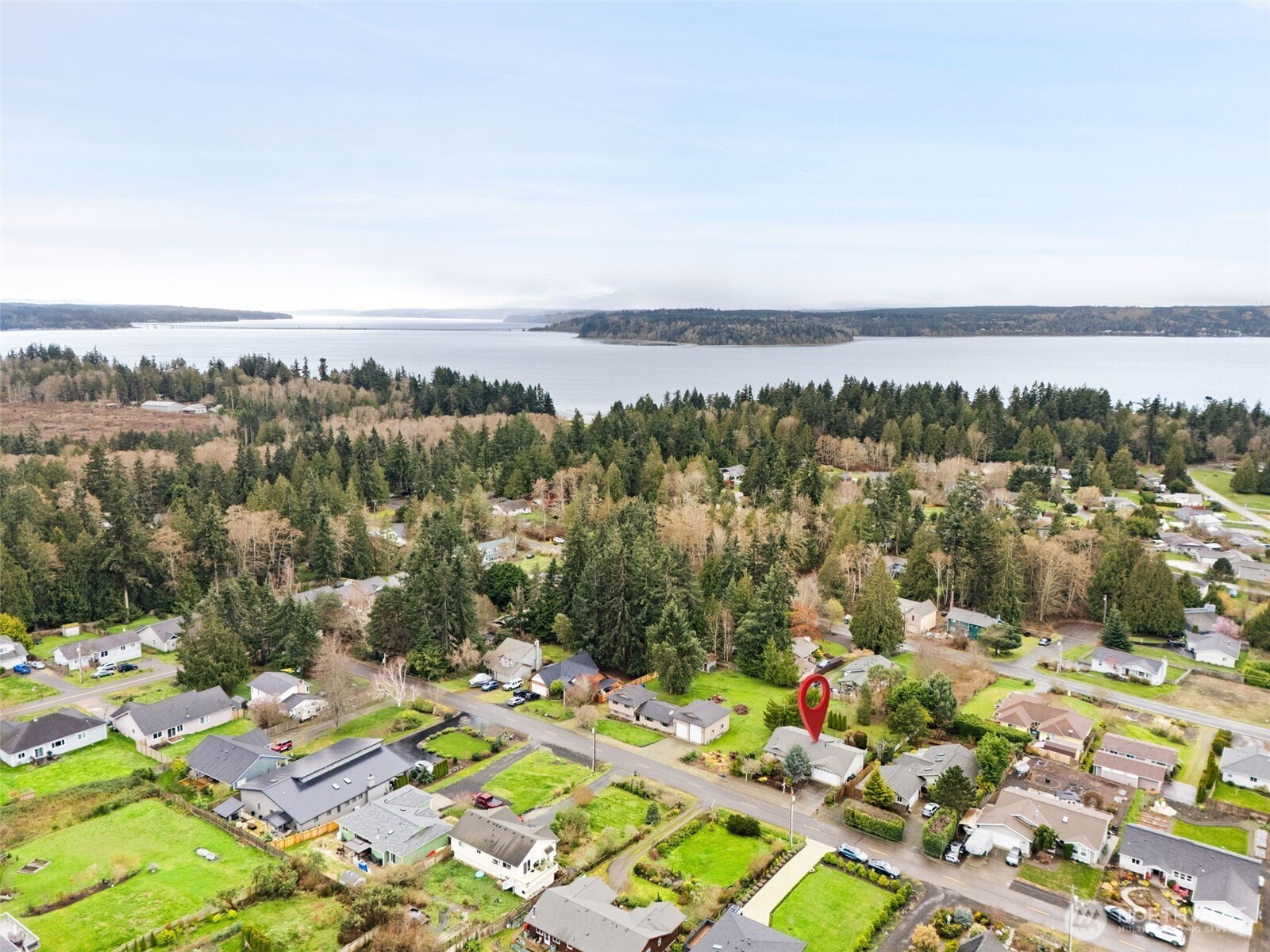 37399 Buck Road Northeast Hansville, WA 98340 - Photo 39 of 40 a view of a city with mountains in the background