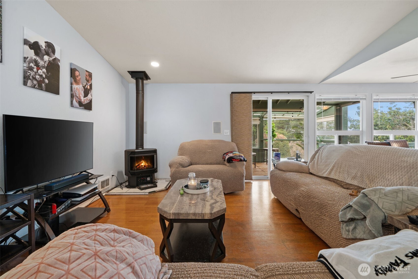 37399 Buck Road Northeast Hansville, WA 98340 - Photo 4 of 40 a living room with furniture and a flat screen tv