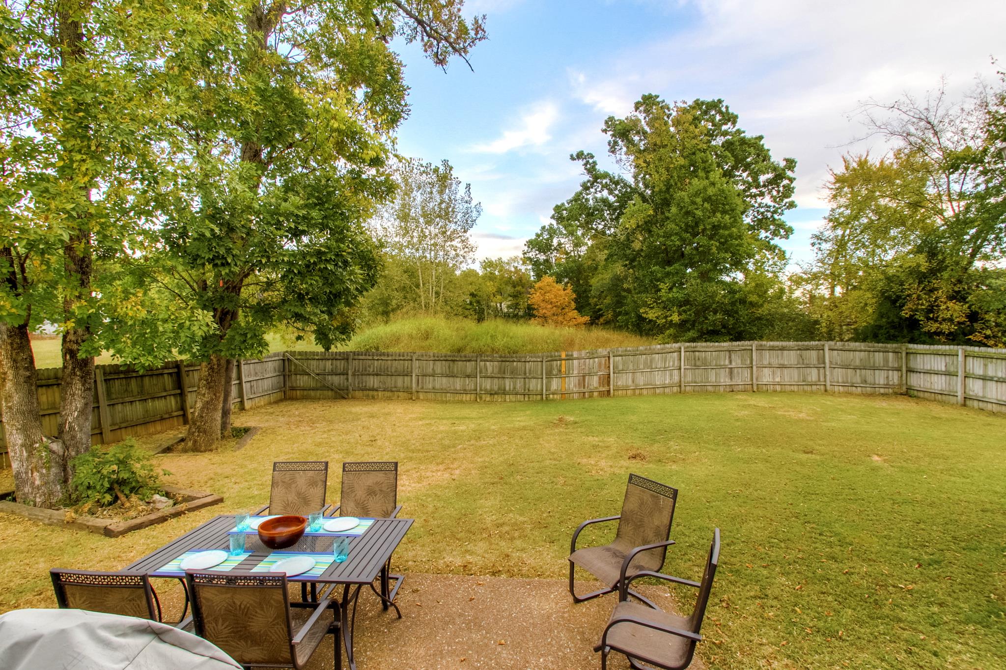 2832 Rippavilla Way Spring Hill, TN 37174 - Photo 13 of 14 a view of a lake with table and chairs