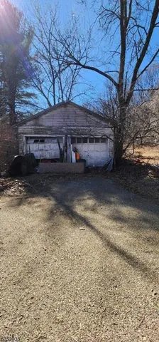 a view of a backyard of the house