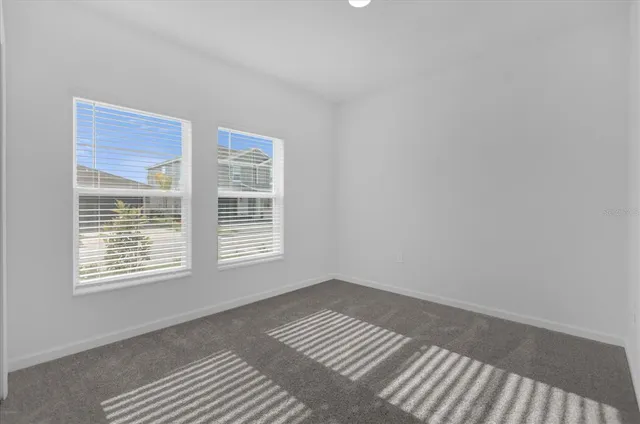 an aerial view of a house with swimming pool