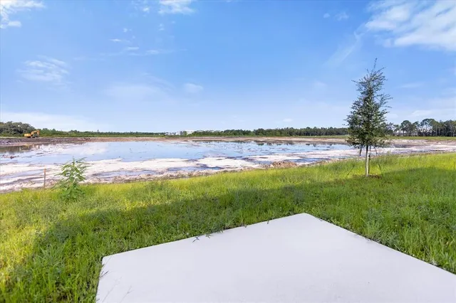 a view of swimming pool with outdoor seating and yard