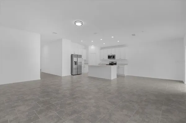 a view of kitchen with white cabinets