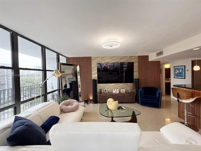 a view of a hallway with a large kitchen area
