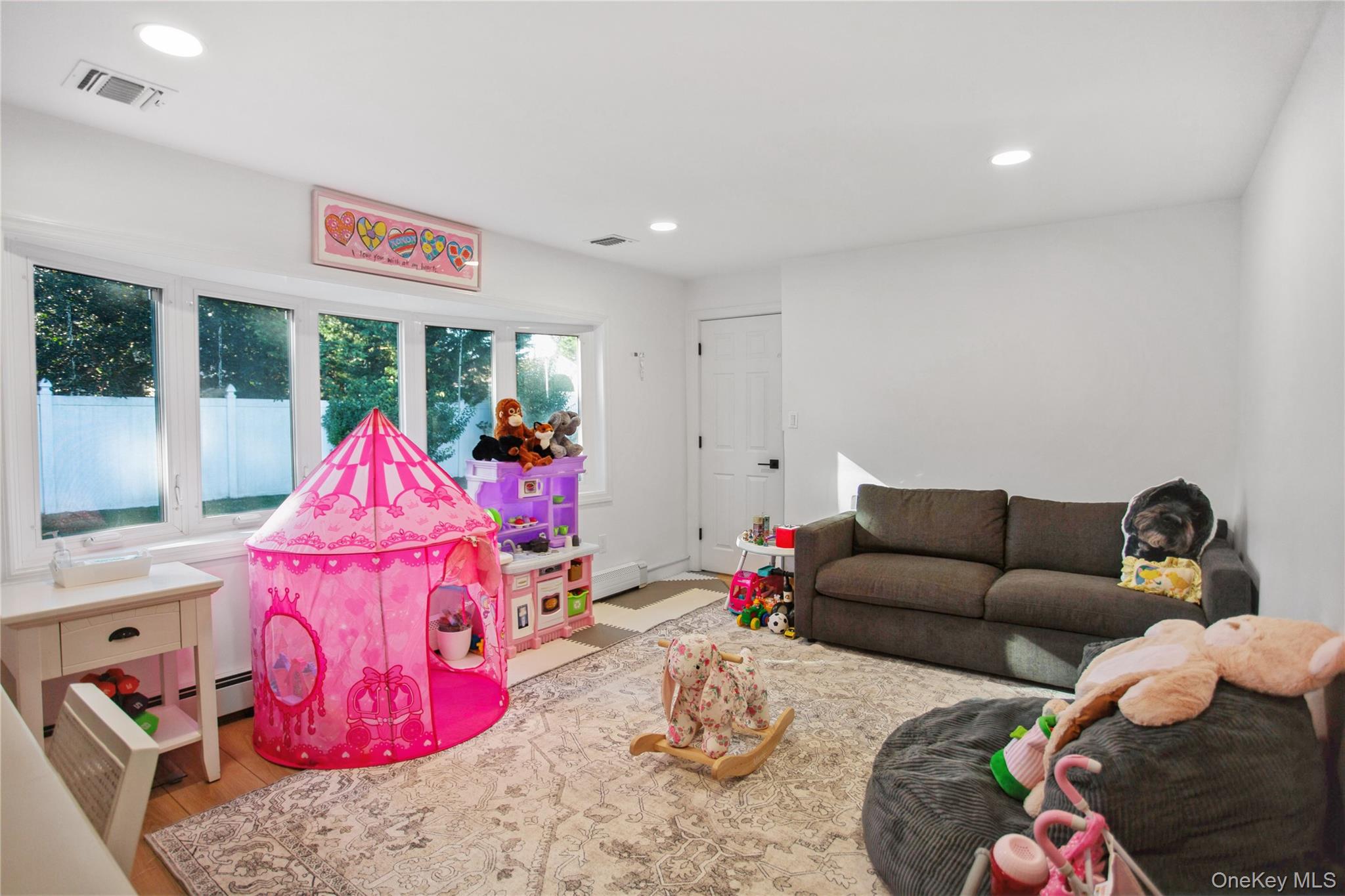 110 Hampton Way Merrick, NY 11566 - Photo 12 of 24 Play room featuring recessed lighting and wood finished floors