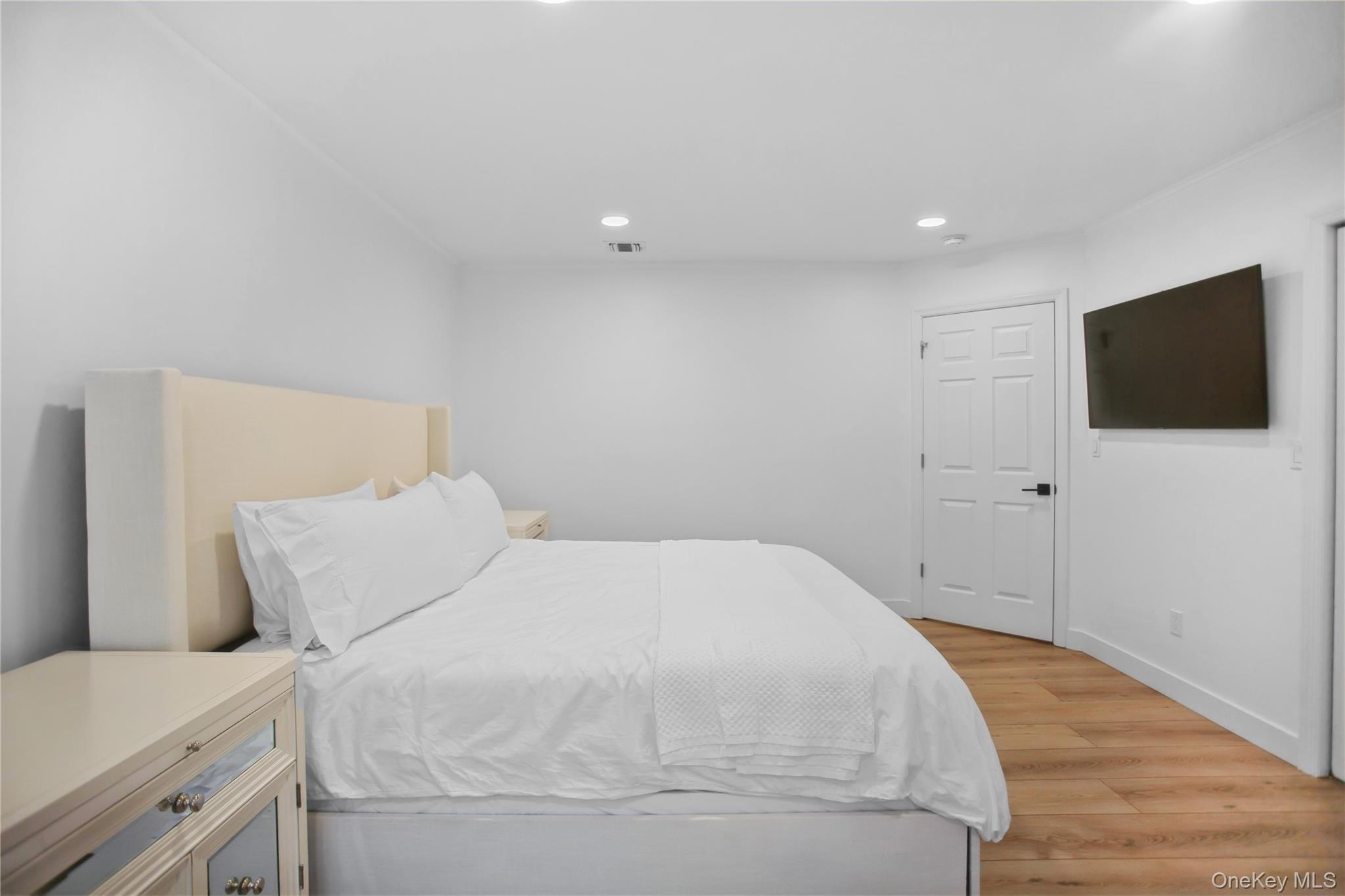 110 Hampton Way Merrick, NY 11566 - Photo 14 of 24 Bedroom featuring light wood finished floors and recessed lighting