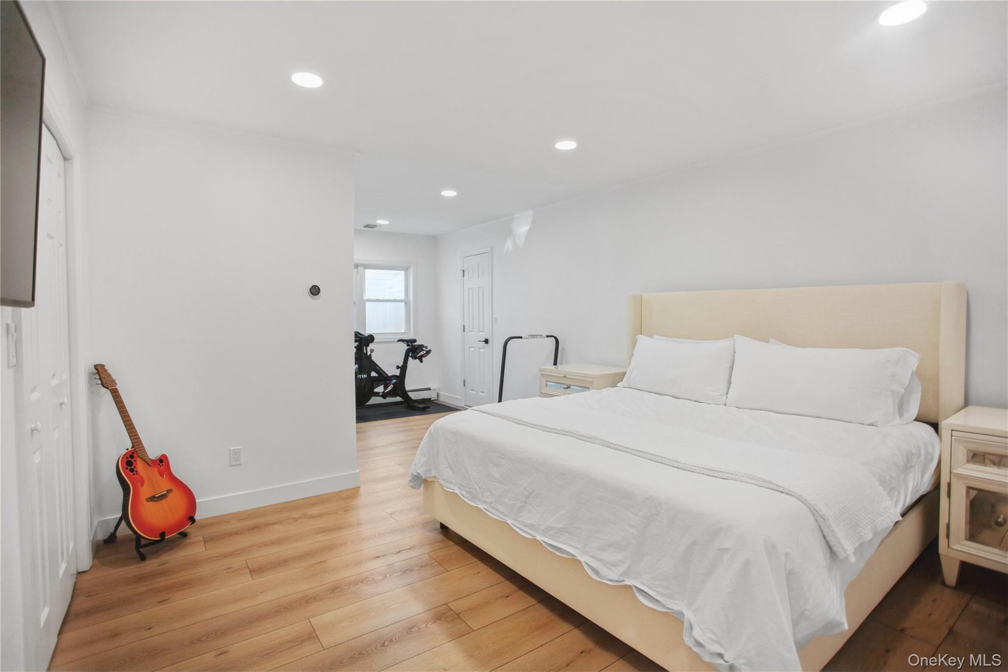 110 Hampton Way Merrick, NY 11566 - Photo 16 of 24 Bedroom with hardwood / wood-style floors and recessed lighting