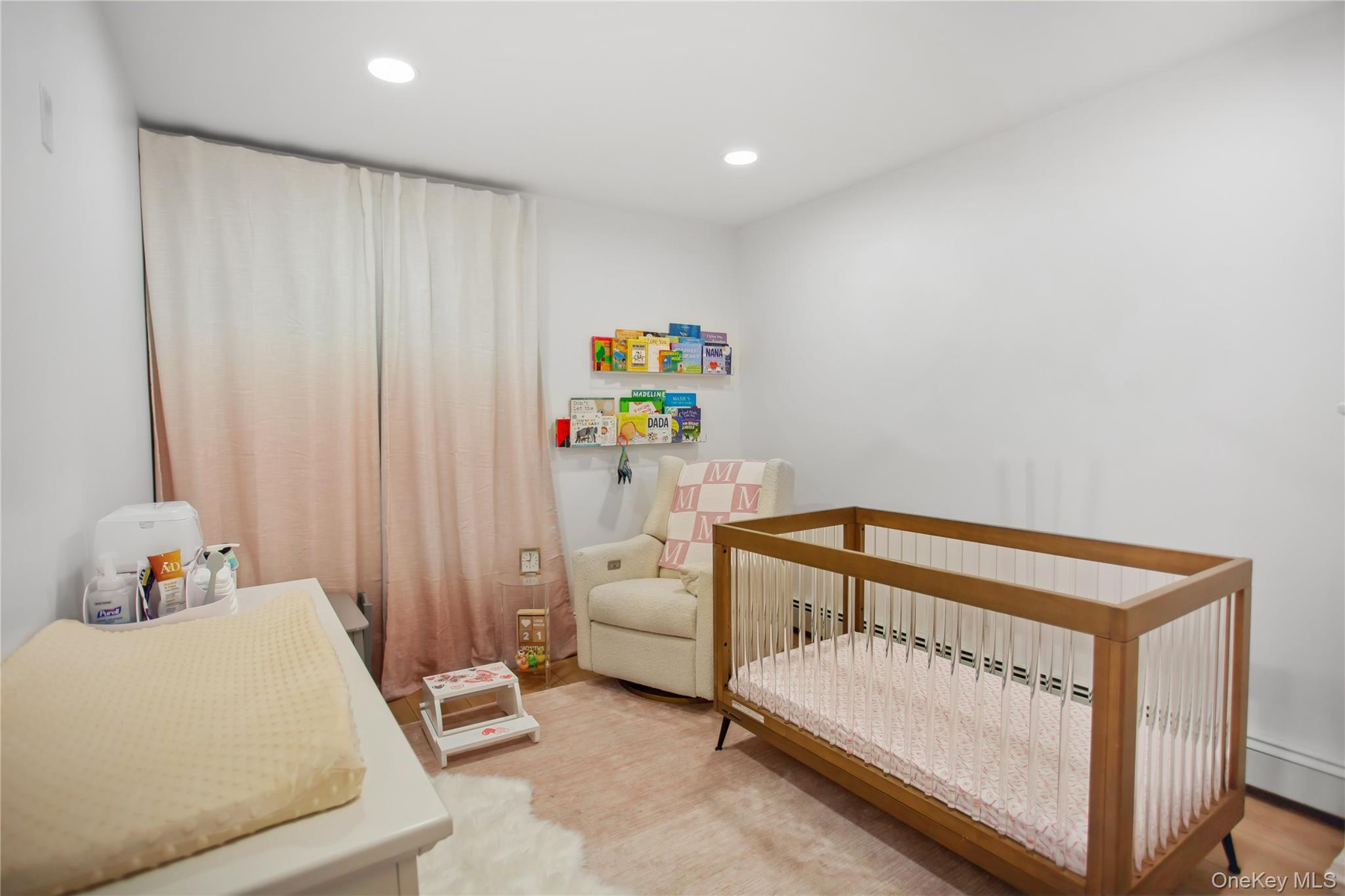 110 Hampton Way Merrick, NY 11566 - Photo 17 of 24 Bedroom featuring a nursery area, recessed lighting, and wood finished floors