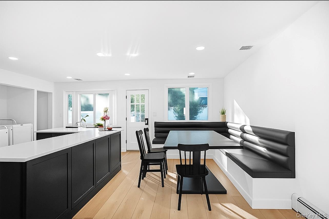 110 Hampton Way Merrick, NY 11566 - Photo 5 of 24 Vitually Staged Dining room with baseboard heating, breakfast area, light wood-style flooring, and recessed lighting