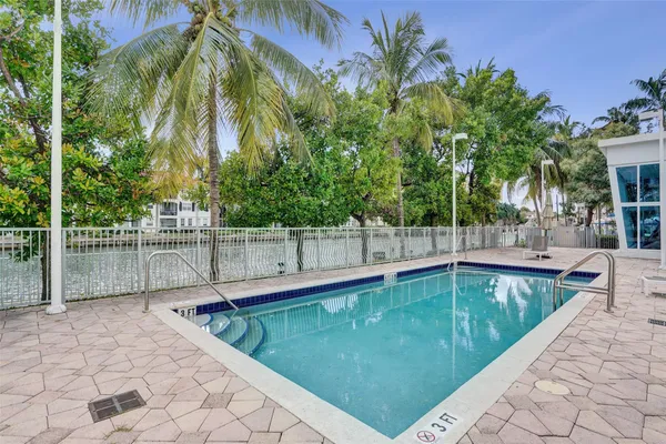 a view of a swimming pool with a patio