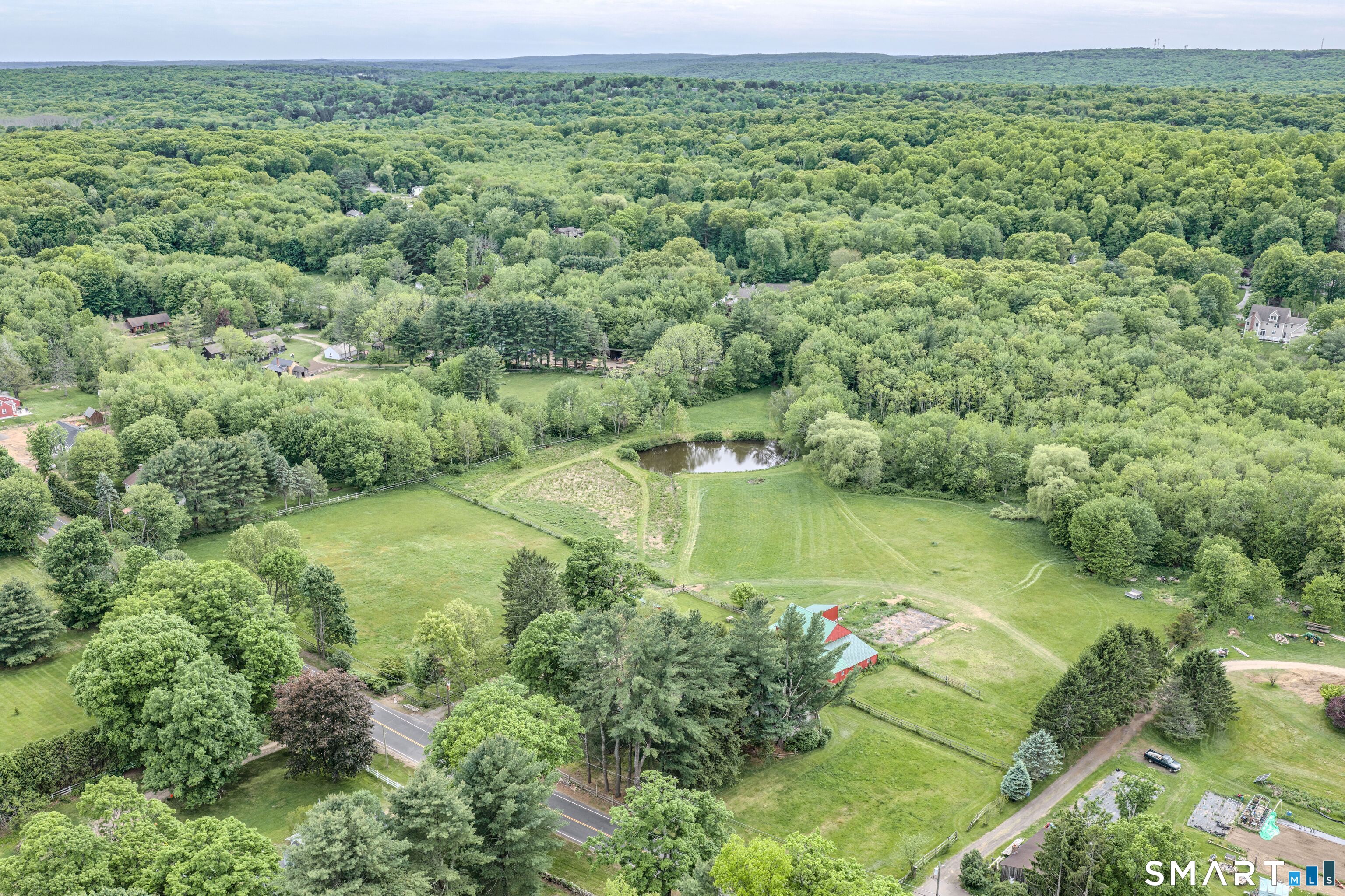 261 Hebron Road Bolton, CT 06043 - Photo 27 of 40 an aerial view of a houses with a yard and lake view