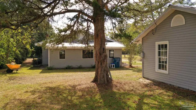 a view of a swimming pool with an outdoor space and seating area