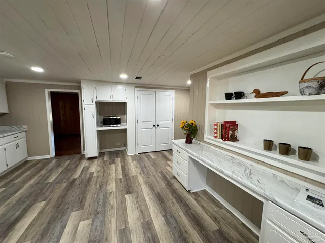 a kitchen with granite countertop stainless steel appliances and sink