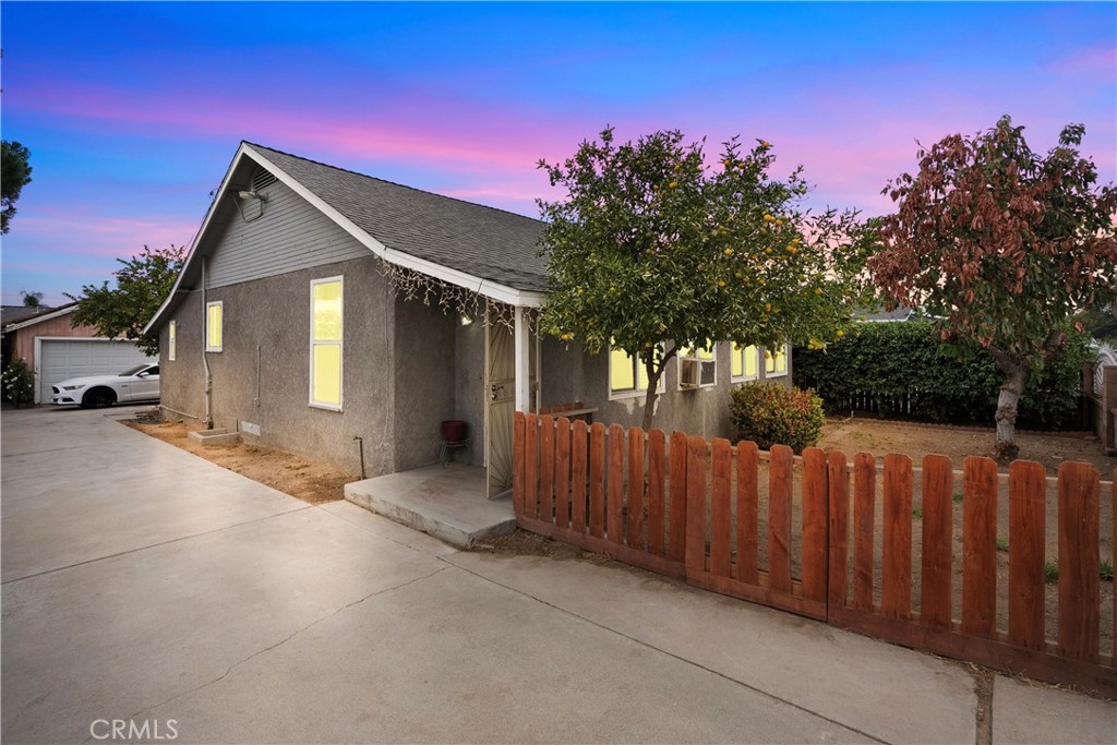 575 Prospect Avenue Riverside, CA 92507 - Photo 1 of 1 a front view of a house with wooden fence